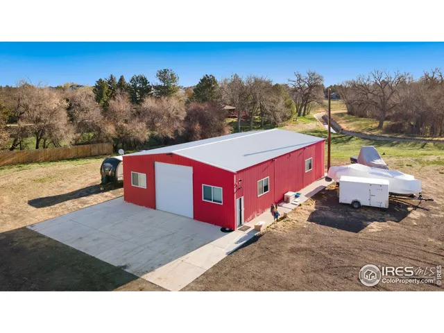 a balcony with furniture and a yard
