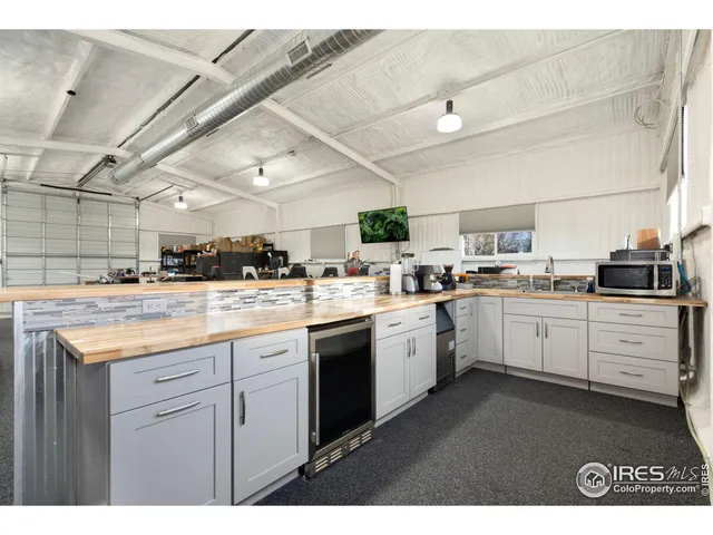 a kitchen with cabinets and window