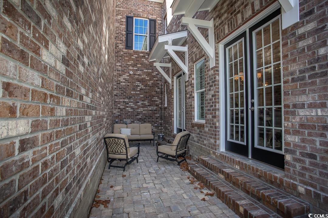 852 Iris Street, Unit D Myrtle Beach, SC 29577 - Photo 11 of 36 Private gaited Courtyard with pavers off the Living /Dining Room. Extra gas line for grill or outdoor fireplace