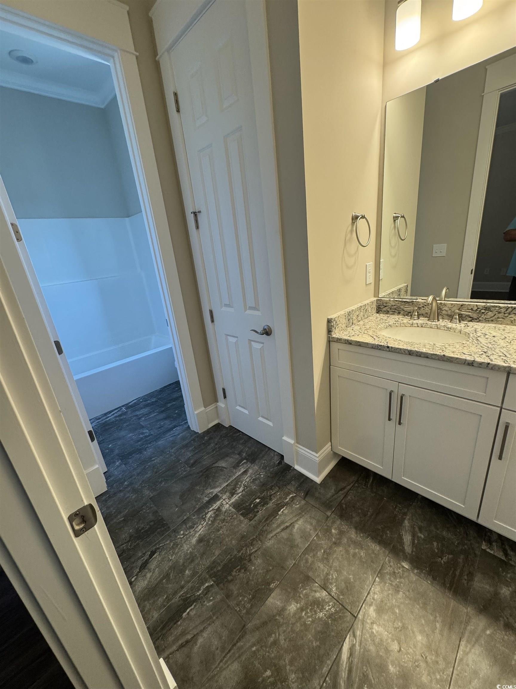 852 Iris Street, Unit D Myrtle Beach, SC 29577 - Photo 20 of 36 Full bath with vanity and baseboards