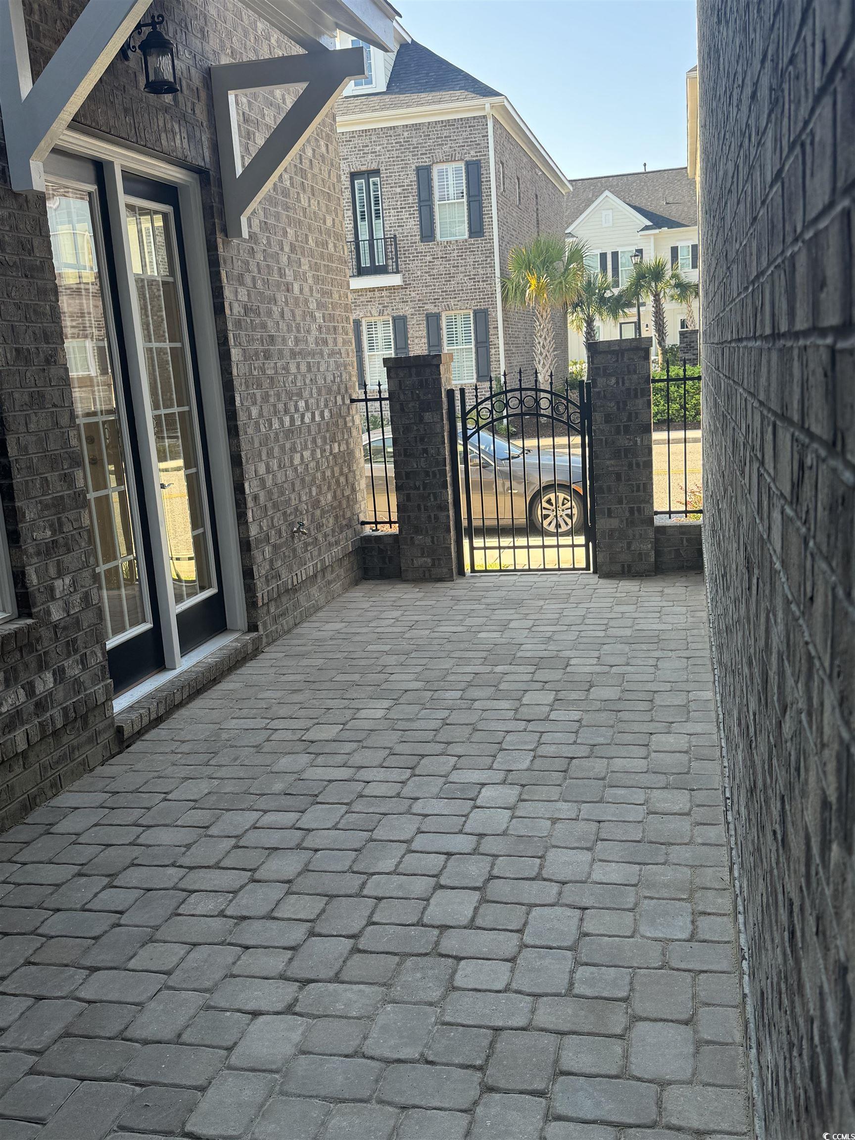 852 Iris Street, Unit D Myrtle Beach, SC 29577 - Photo 27 of 36 View of patio featuring a gate