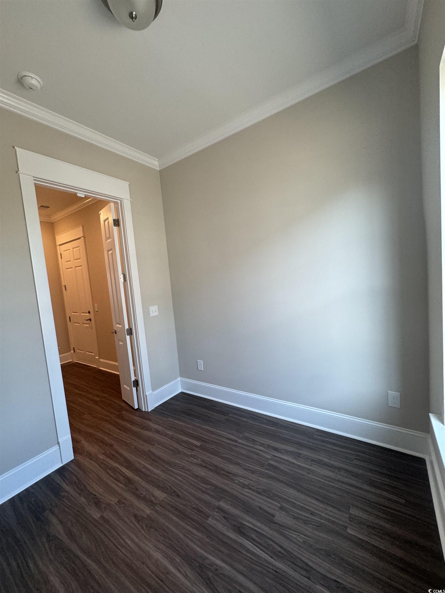 852 Iris Street, Unit D Myrtle Beach, SC 29577 - Photo 30 of 36 Office featuring ornamental molding, dark wood-type flooring, and a smoke detector