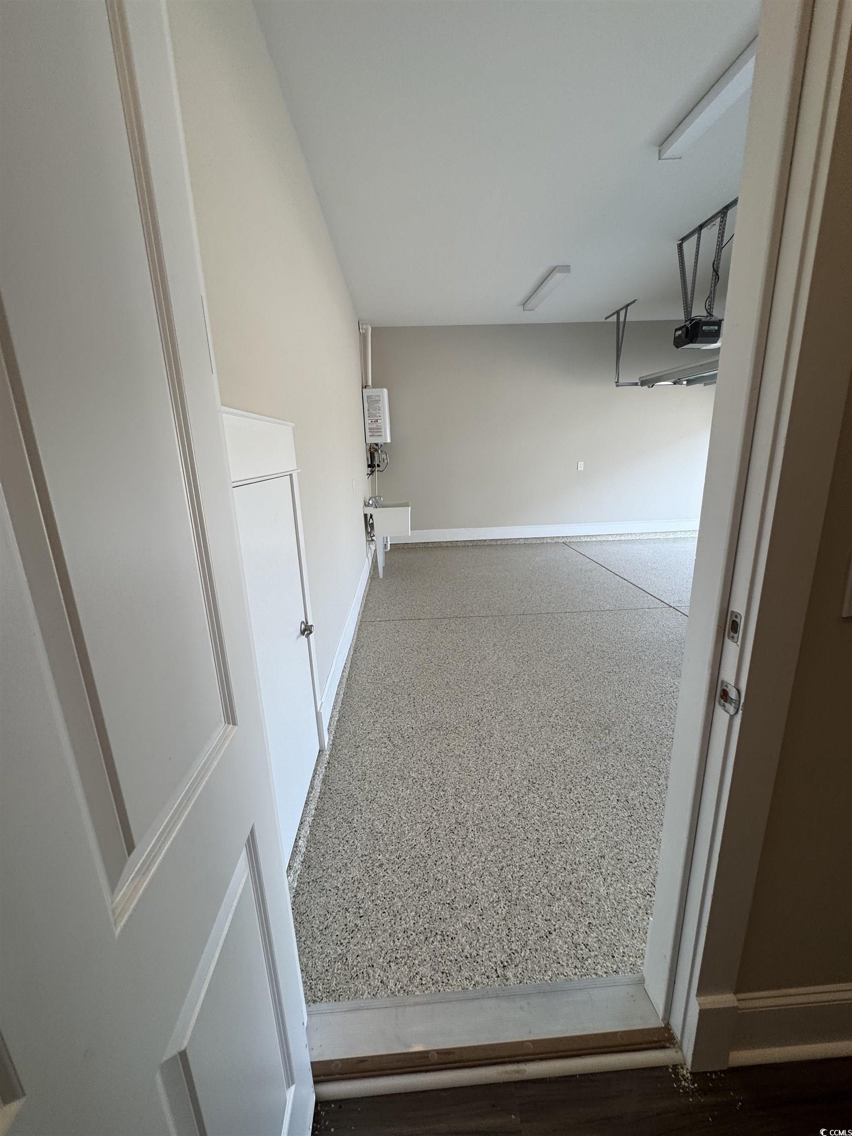 852 Iris Street, Unit D Myrtle Beach, SC 29577 - Photo 31 of 36 Corridor featuring baseboards
