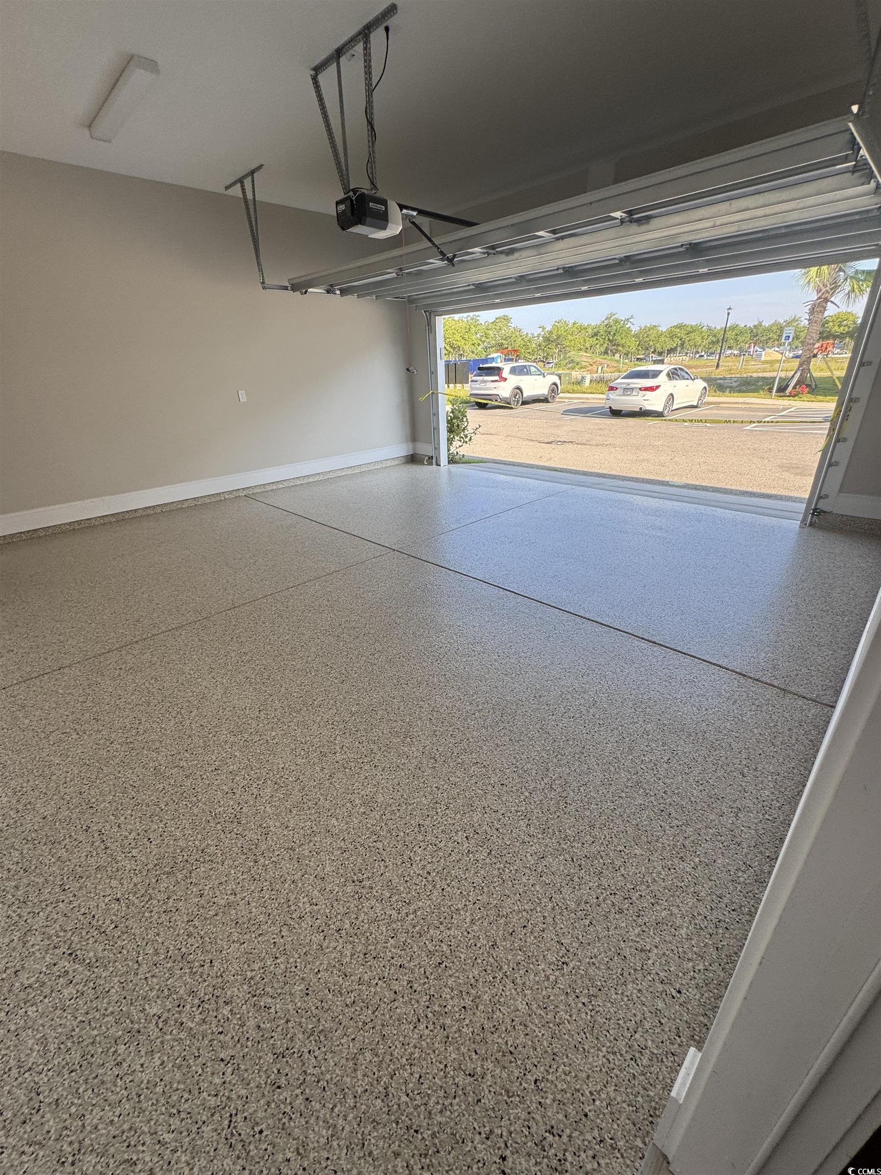 852 Iris Street, Unit D Myrtle Beach, SC 29577 - Photo 34 of 36 Garage with baseboards and a garage door opener