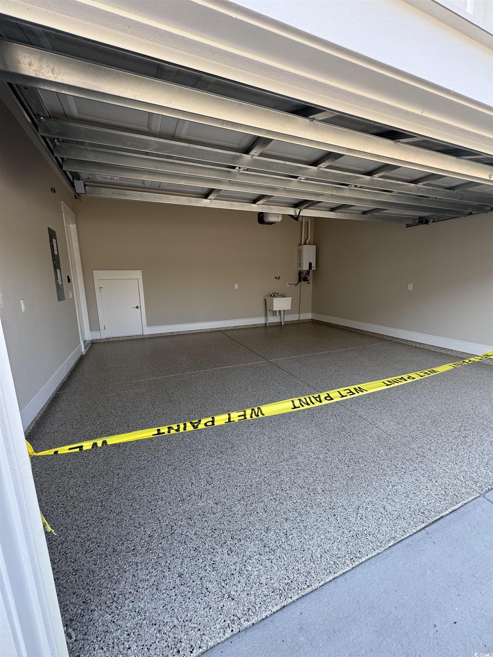 852 Iris Street, Unit D Myrtle Beach, SC 29577 - Photo 36 of 36 Garage featuring a sink and electric panel