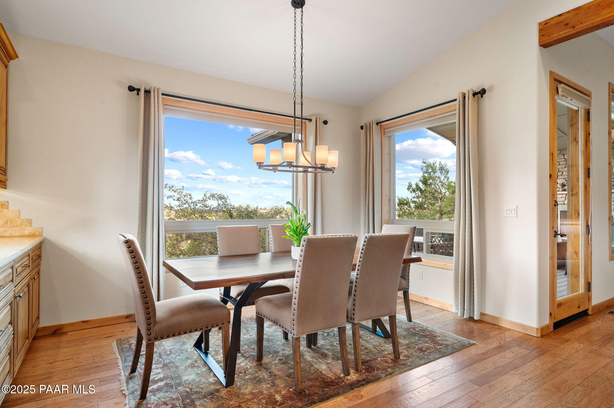 2214 Lichen Ridge Lane Prescott, AZ 86303 - Photo 11 of 46 a view of a dining room with furniture window and wooden floor
