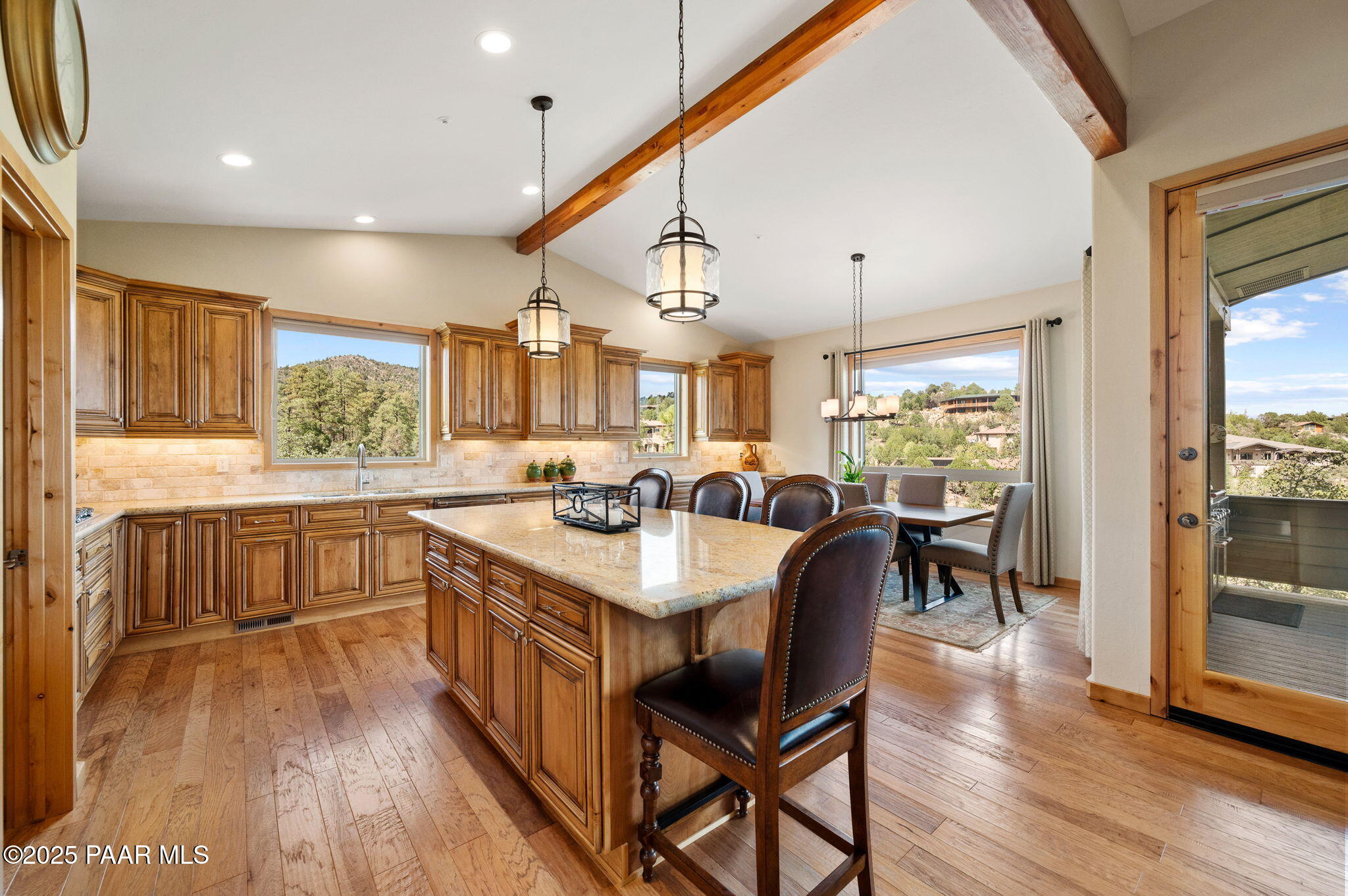 2214 Lichen Ridge Lane Prescott, AZ 86303 - Photo 13 of 46 a large kitchen with a table and chairs