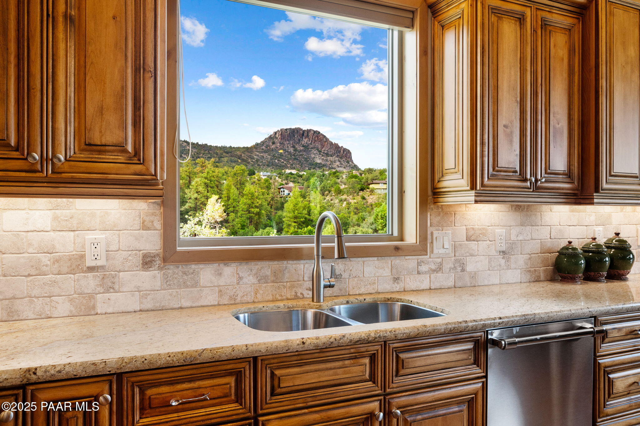 2214 Lichen Ridge Lane Prescott, AZ 86303 - Photo 15 of 46 a kitchen with granite countertop a sink and a window