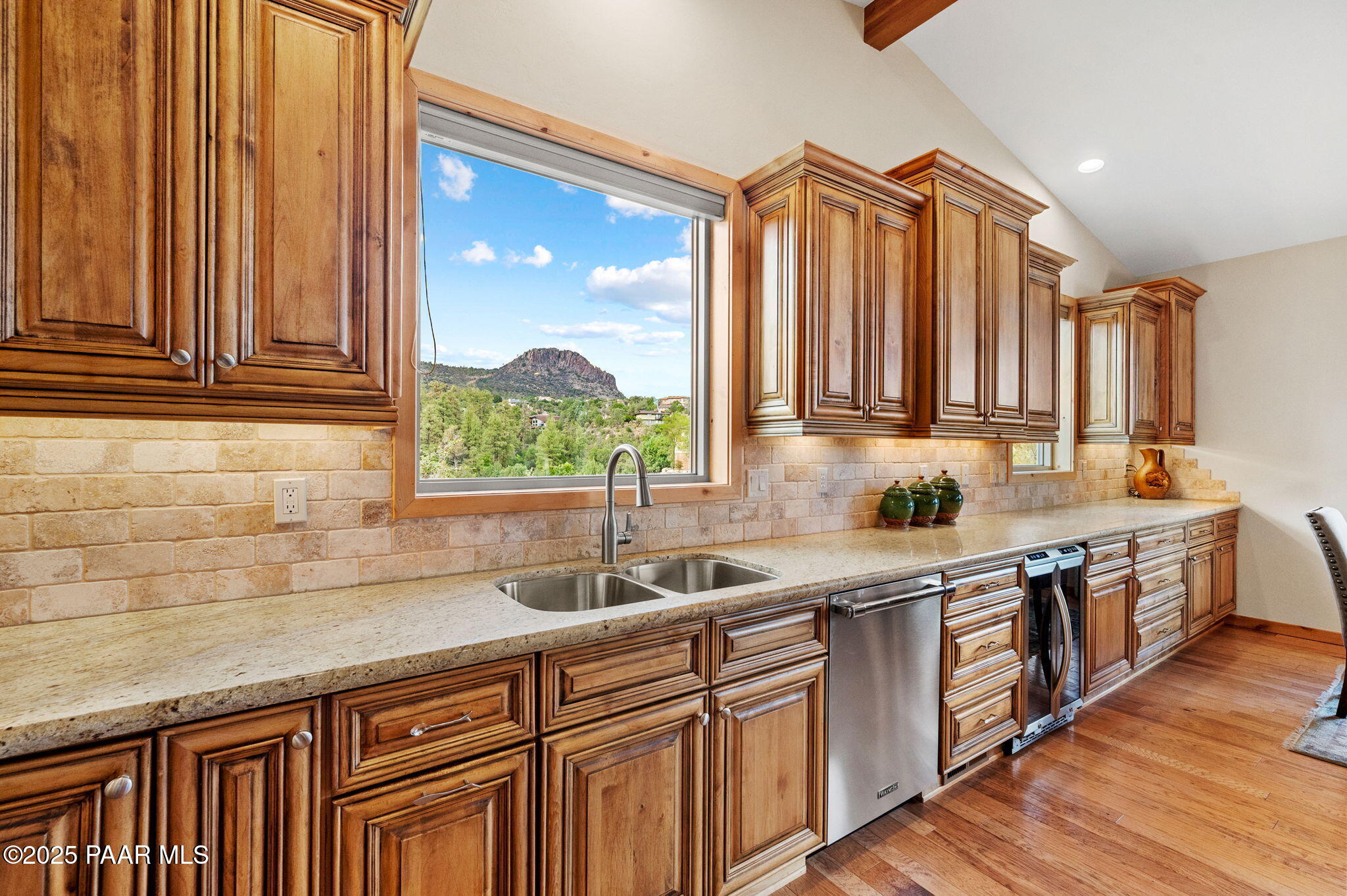 2214 Lichen Ridge Lane Prescott, AZ 86303 - Photo 16 of 46 a kitchen with stainless steel appliances a sink a stove and cabinets