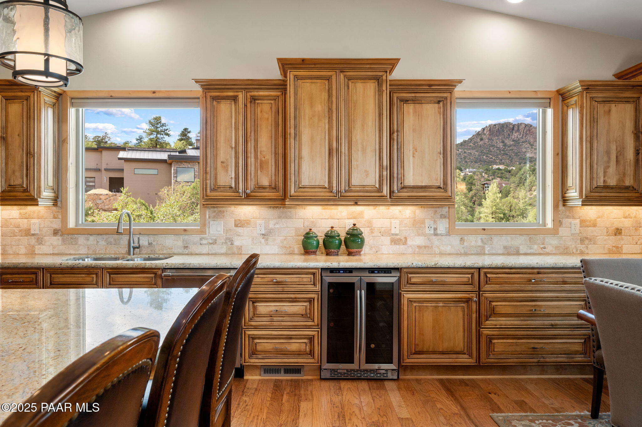 2214 Lichen Ridge Lane Prescott, AZ 86303 - Photo 18 of 46 a kitchen with granite countertop a sink and cabinets