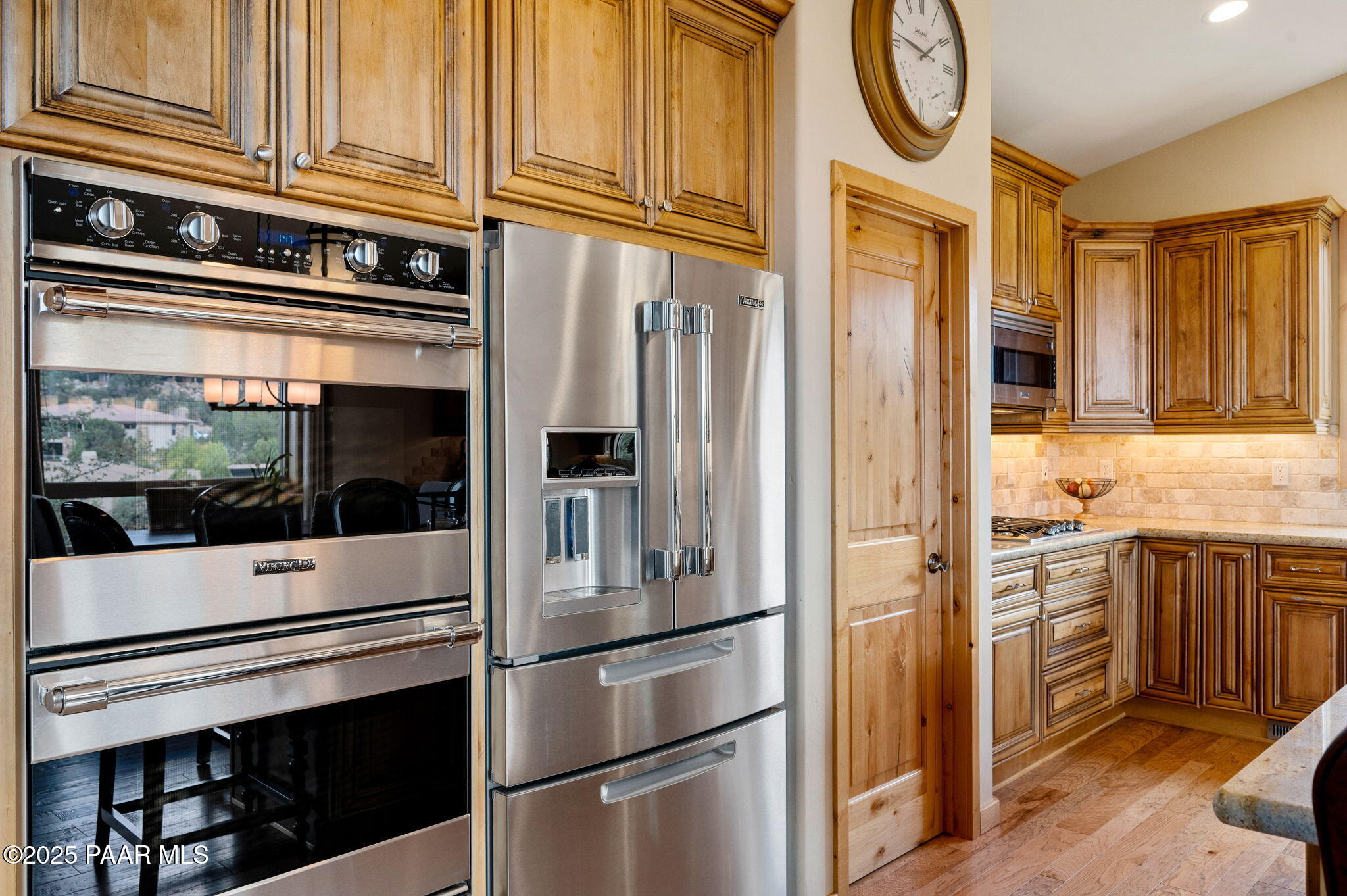 2214 Lichen Ridge Lane Prescott, AZ 86303 - Photo 19 of 46 a kitchen with stainless steel appliances granite countertop a refrigerator and a stove top oven