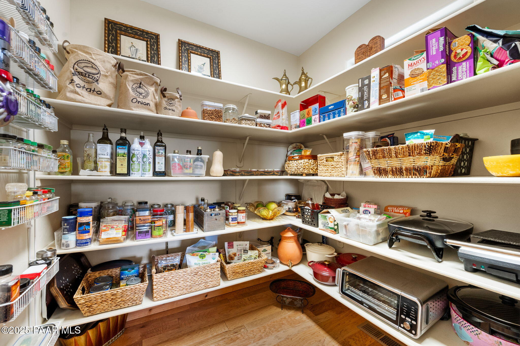 2214 Lichen Ridge Lane Prescott, AZ 86303 - Photo 20 of 46 a room with lots of books and a refrigerator