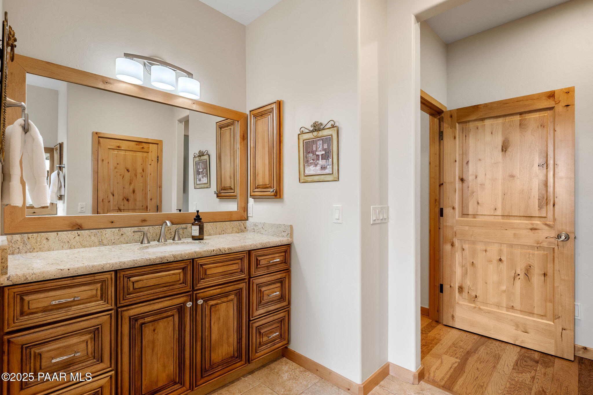 2214 Lichen Ridge Lane Prescott, AZ 86303 - Photo 25 of 46 a bathroom with a granite countertop sink mirror and
