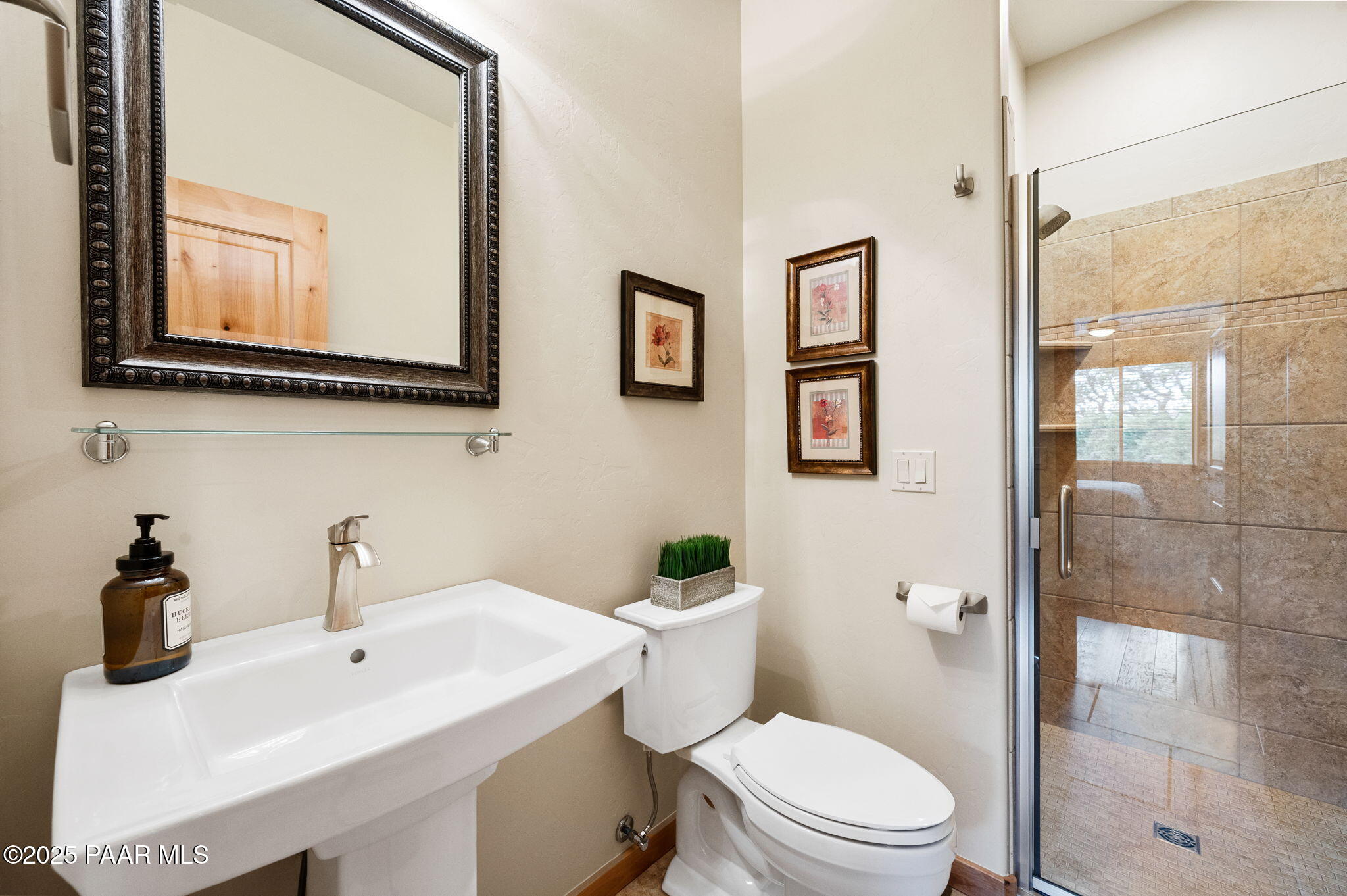 2214 Lichen Ridge Lane Prescott, AZ 86303 - Photo 28 of 46 a bathroom with a toilet a sink and mirror