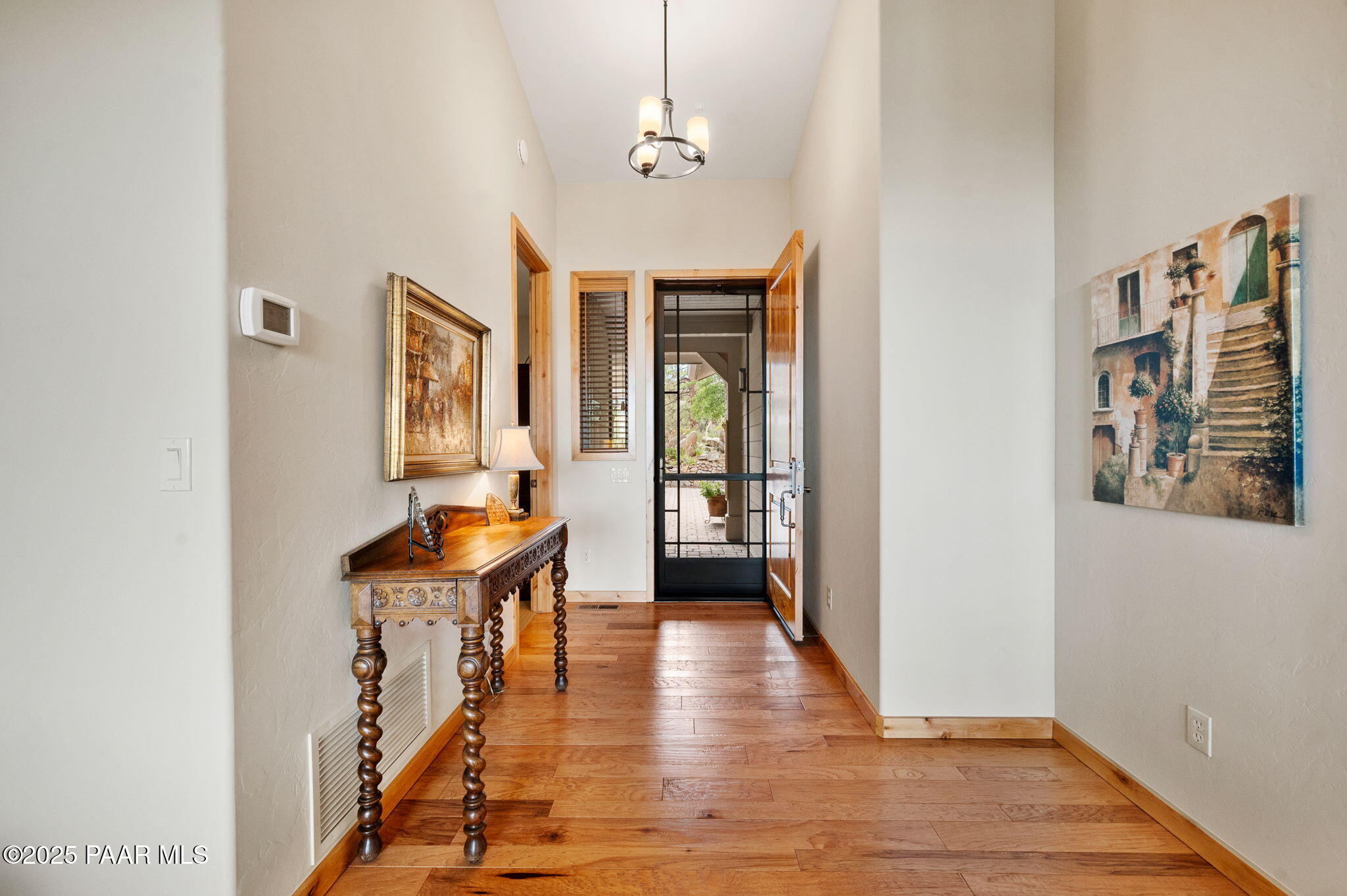 2214 Lichen Ridge Lane Prescott, AZ 86303 - Photo 3 of 46 a view of a hallway with wooden floor and staircase
