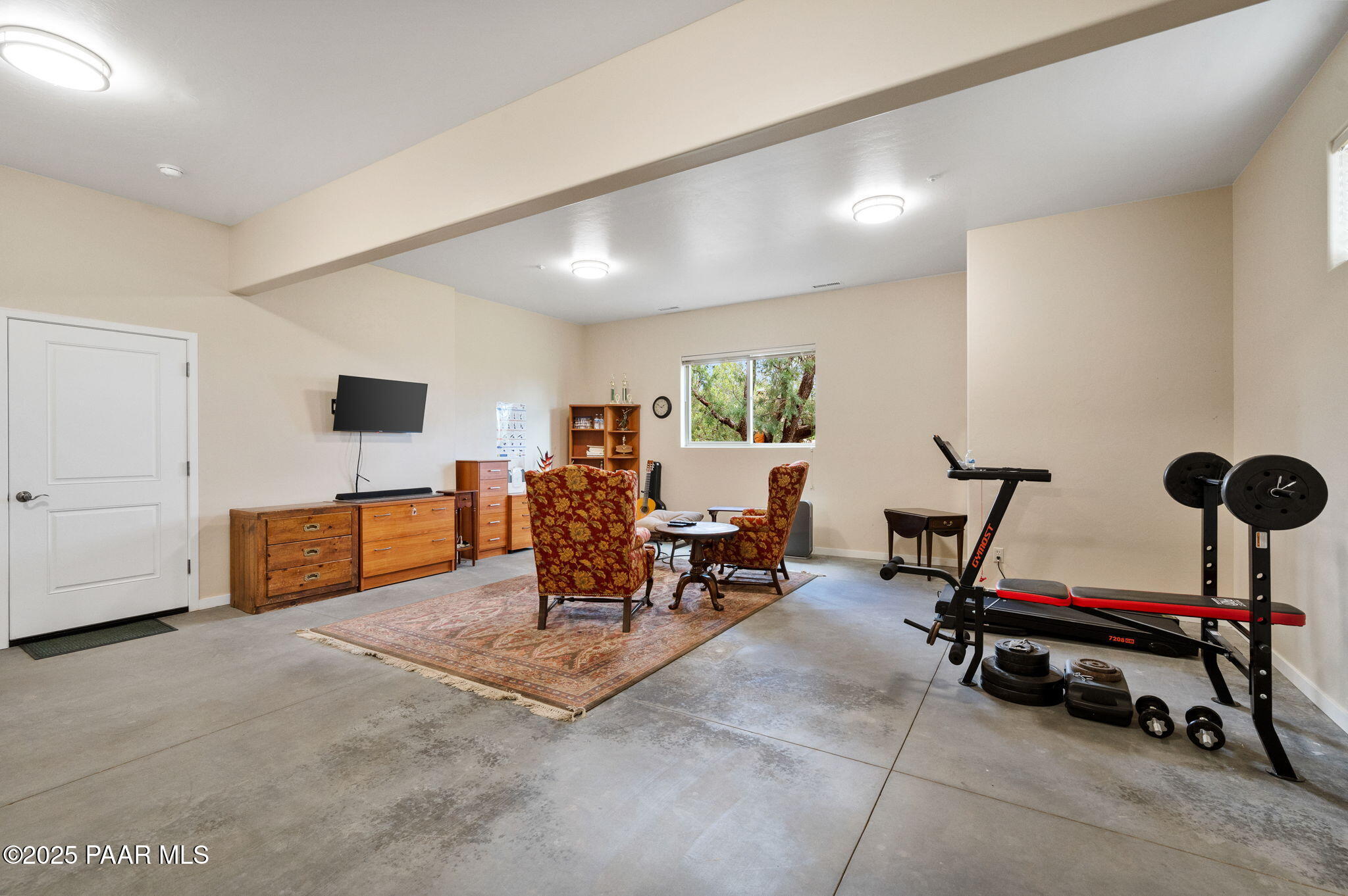 2214 Lichen Ridge Lane Prescott, AZ 86303 - Photo 36 of 46 a living room with furniture gym equipment and a table