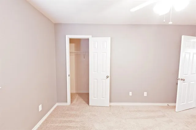 a view of a big room with carpet