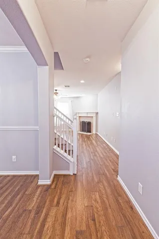 a view of a livingroom with wooden floor