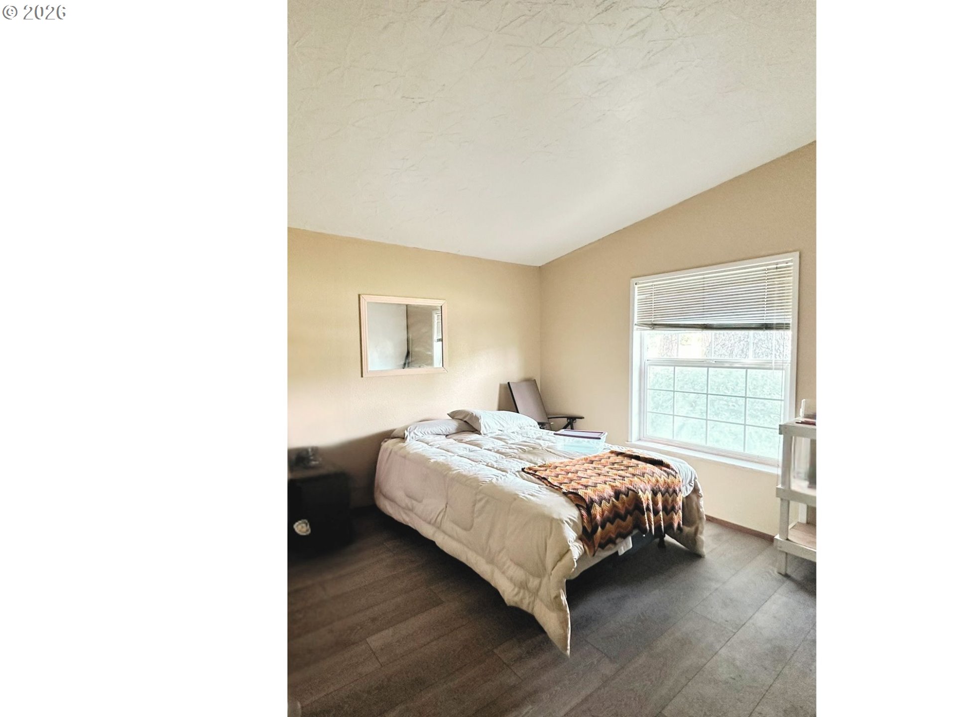 4821 Northeast 50th Street Neotsu, OR 97364 - Photo 10 of 19 a bedroom with a bed and a window