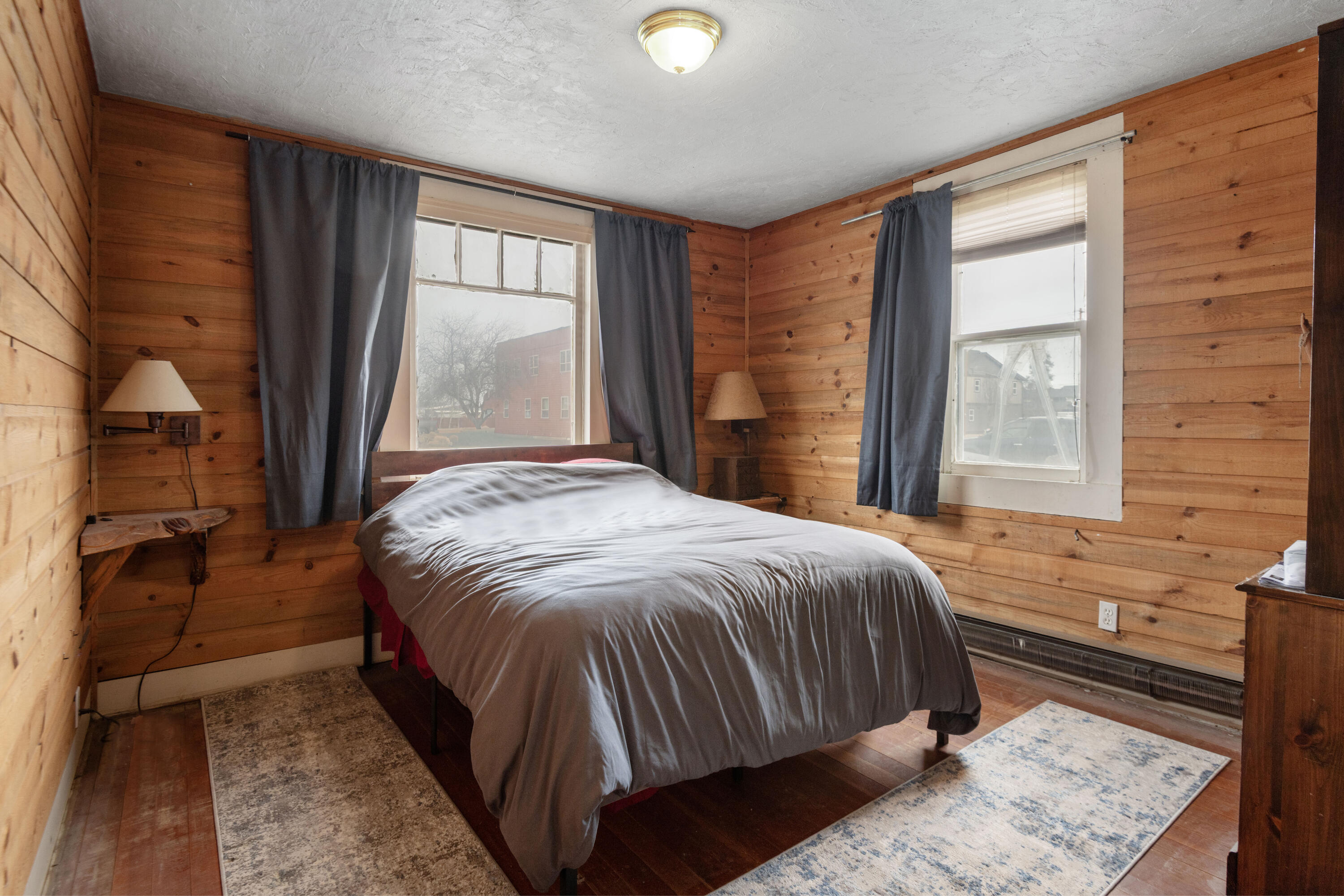 243 West Adams Avenue Sisters, OR 97759 - Photo 7 of 19 a bedroom with a bed and a window with outer view
