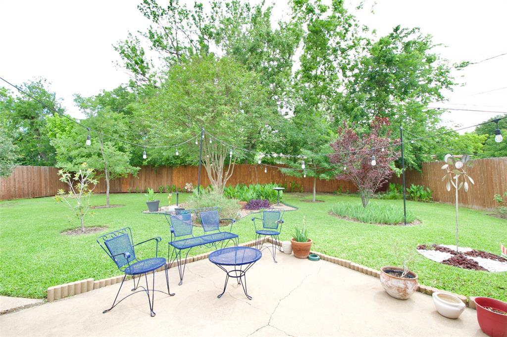 1307 North 65th Street Waco, TX 76710 - Photo 24 of 35 a view of a table and chairs in backyard of the house