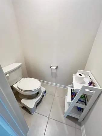 a bathroom with a toilet and a sink