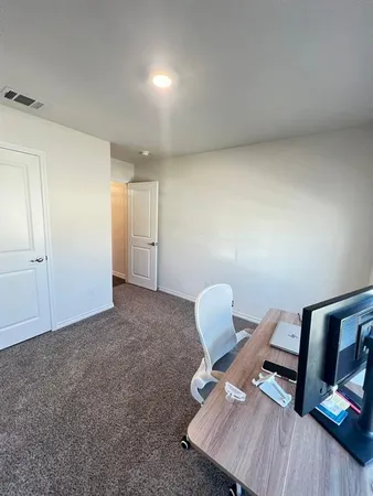 a view of a workspace with furniture