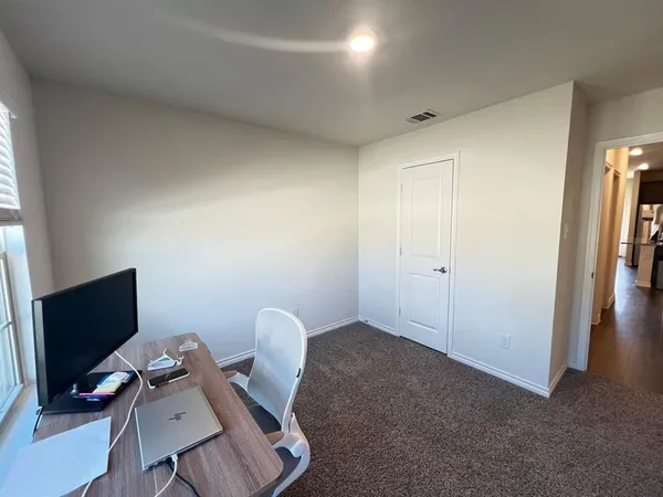 a workspace with furniture and wooden floor