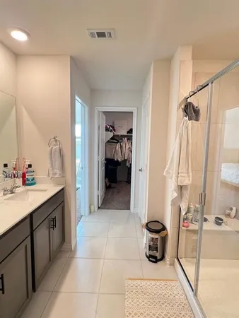 a bathroom with a sink and mirror