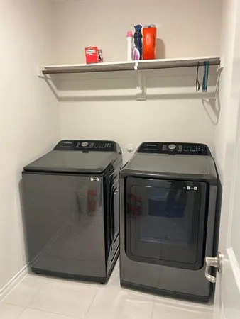 a utility room with washing machine