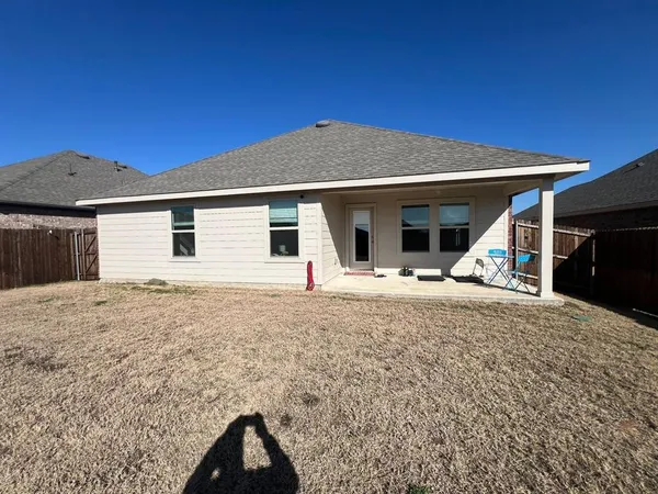 a house with yard in front of it