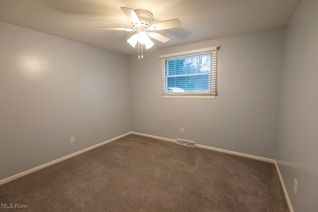 11819 Sheldon Road Mantua, OH 44255 - Photo 15 of 46 Unfurnished bedroom 1 with ceiling fan and carpet