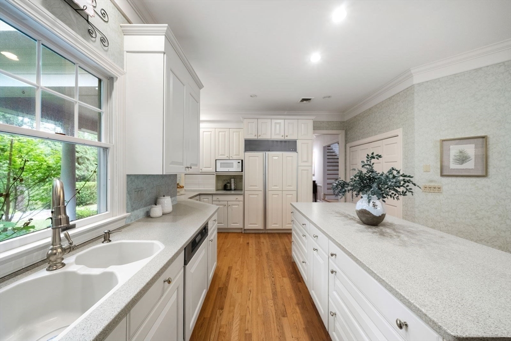 364 Hickory Road North Attleboro, MA 02760 - Photo 12 of 40 a large white kitchen with a large window and stainless steel appliances