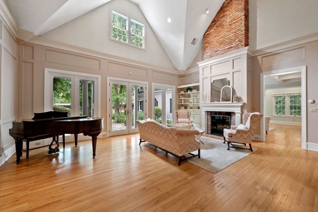 364 Hickory Road North Attleboro, MA 02760 - Photo 22 of 40 a living room with furniture a fireplace and a table