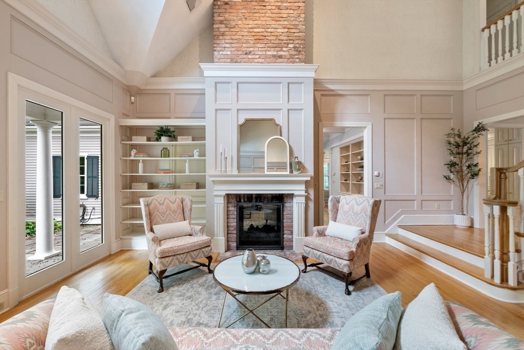 364 Hickory Road North Attleboro, MA 02760 - Photo 25 of 40 a living room with furniture a fireplace and a large window with balcony view