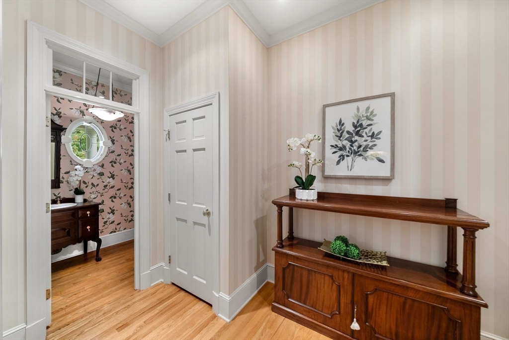 364 Hickory Road North Attleboro, MA 02760 - Photo 26 of 40 a view of a hallway to a livingroom with wooden floor and furniture