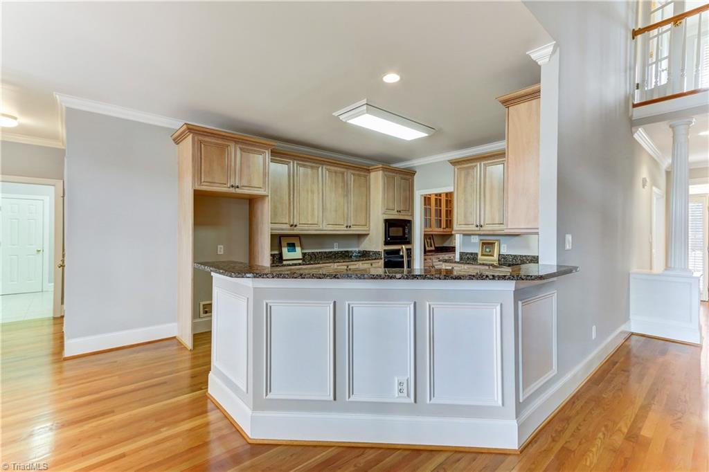 5803 Scarlett Court Oak Ridge, NC 27310 - Photo 9 of 30 Kitchen Breakfast Bar