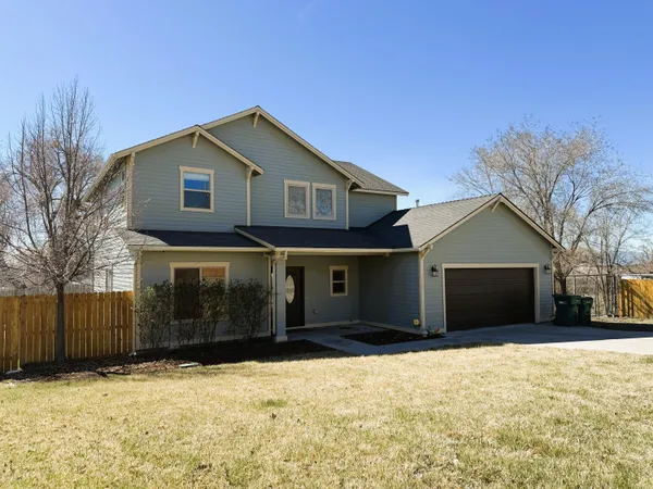 a front view of house with a yard