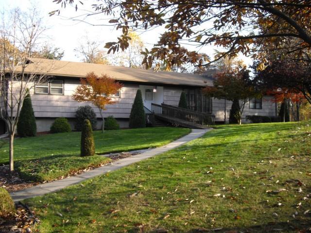a view of a house with a yard