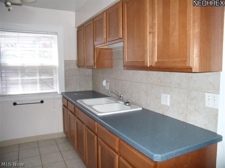16711 Kenyon Road, Unit DOWN Cleveland, OH 44120 - Photo 6 of 11 One wall of the kitchen.