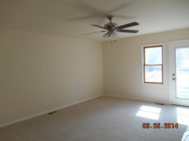 9 Edgewood Road Vernon Hills, IL 60061 - Photo 12 of 13 an empty room with windows and fan