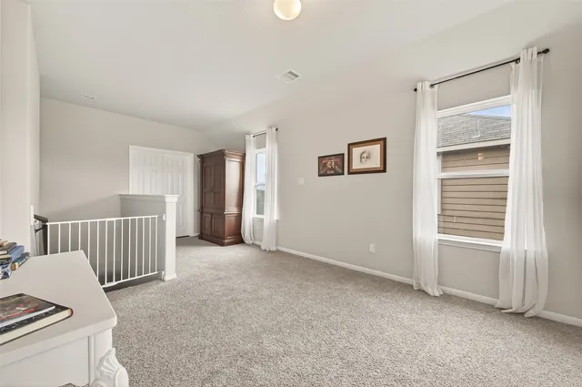 a view of livingroom with furniture and refrigerator