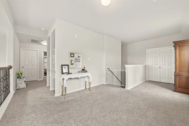 a living room with lots of books