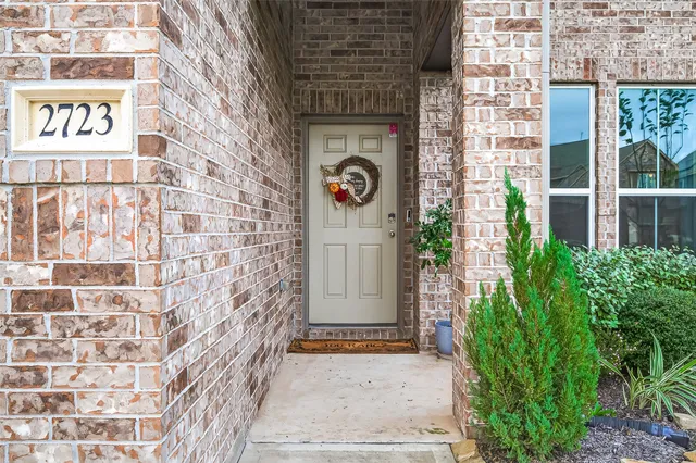 a spacious bathroom with a double vanity sink and a mirror
