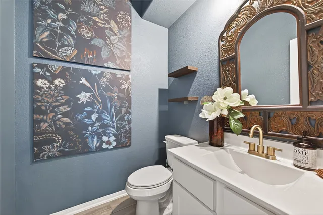 a living room with furniture wooden floor and a view of kitchen
