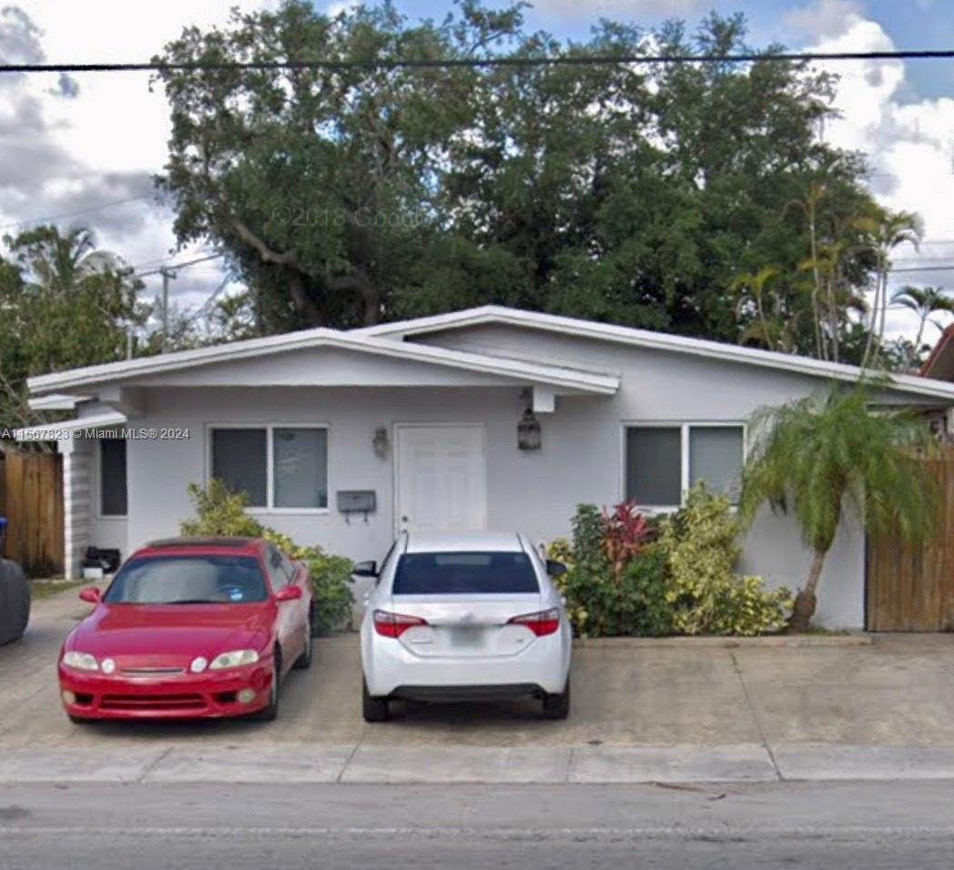 2862 Southwest 32nd Avenue Miami, FL 33133 - Photo 2 of 8 a car parked in front of a white house