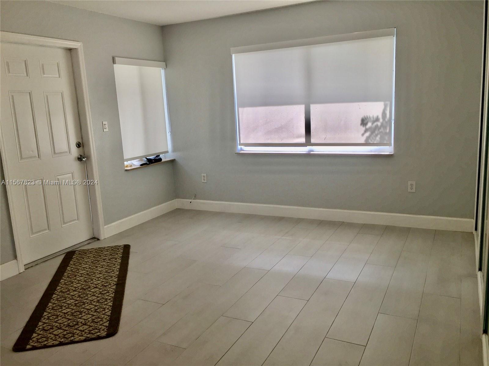 2862 Southwest 32nd Avenue Miami, FL 33133 - Photo 5 of 8 an entryway and a window in a room