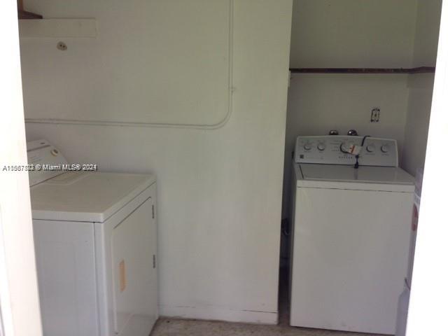 2862 Southwest 32nd Avenue Miami, FL 33133 - Photo 7 of 8 a utility room with dryer and washer