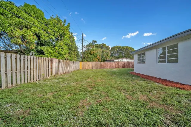 a view of a backyard with green space
