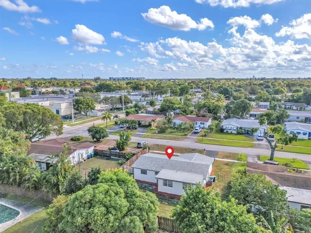a view of a city with lots of trees and houses